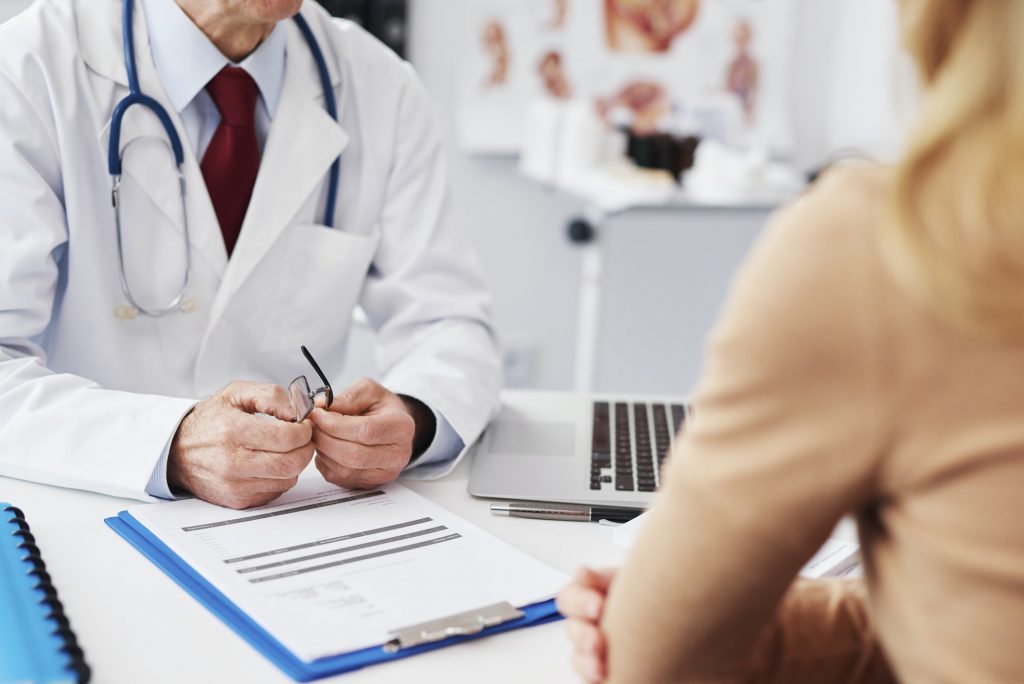 Close up of patient and doctor in doctor's office